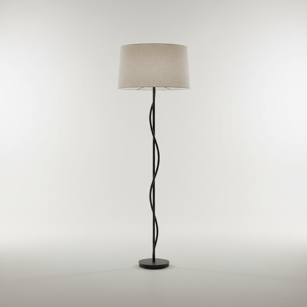 Sculptural matte black floor lamp with linen shade against pale studio background